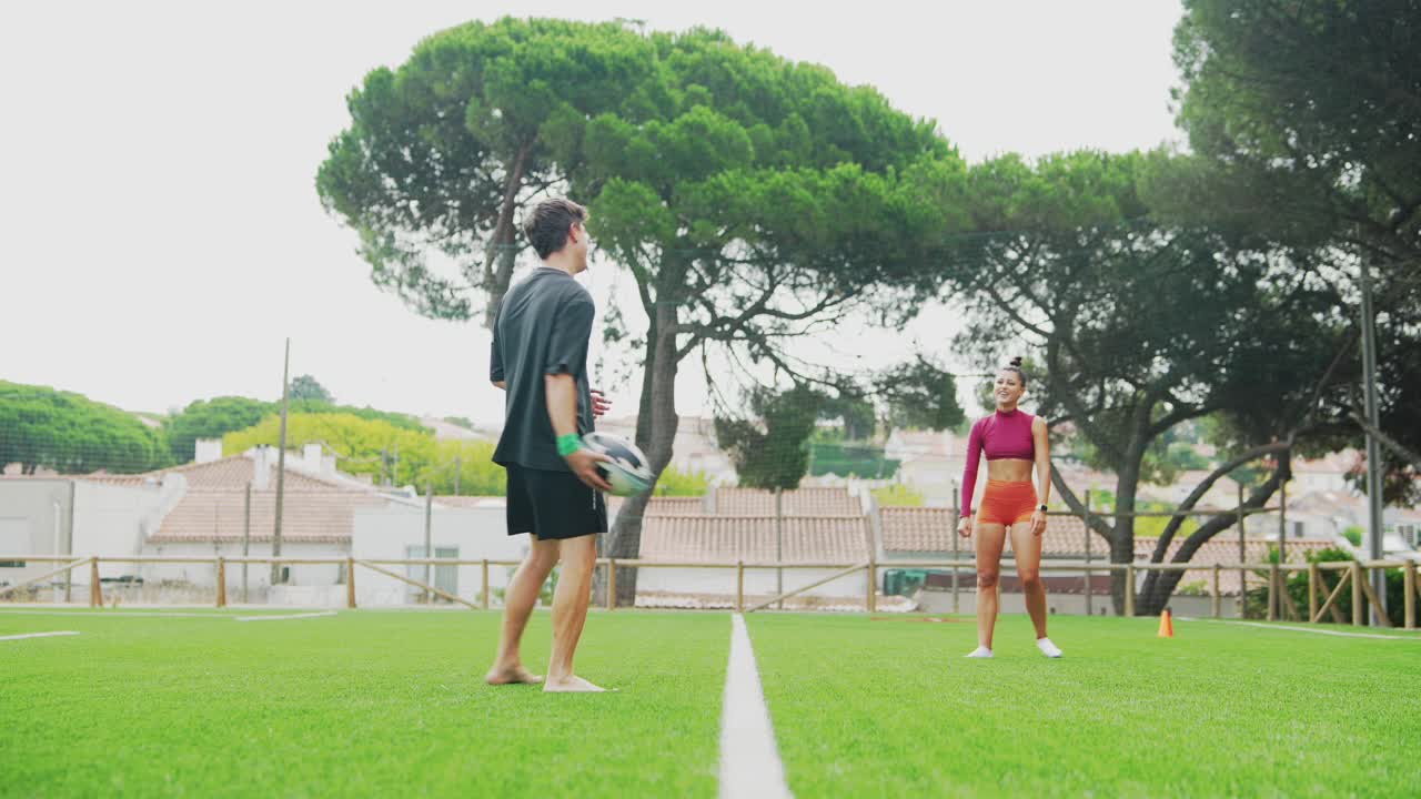 People playing frisbee on a field