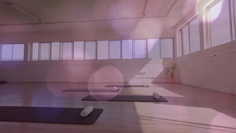 yoga mats and towels in empty studio with bokeh lights animation