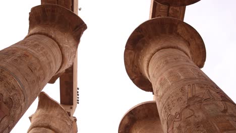 panning-shot-of-tall-columns-full-of-hieroglyphs-in-Hippostyle-hall-of-Karnak-temple-in-luxor-egypt