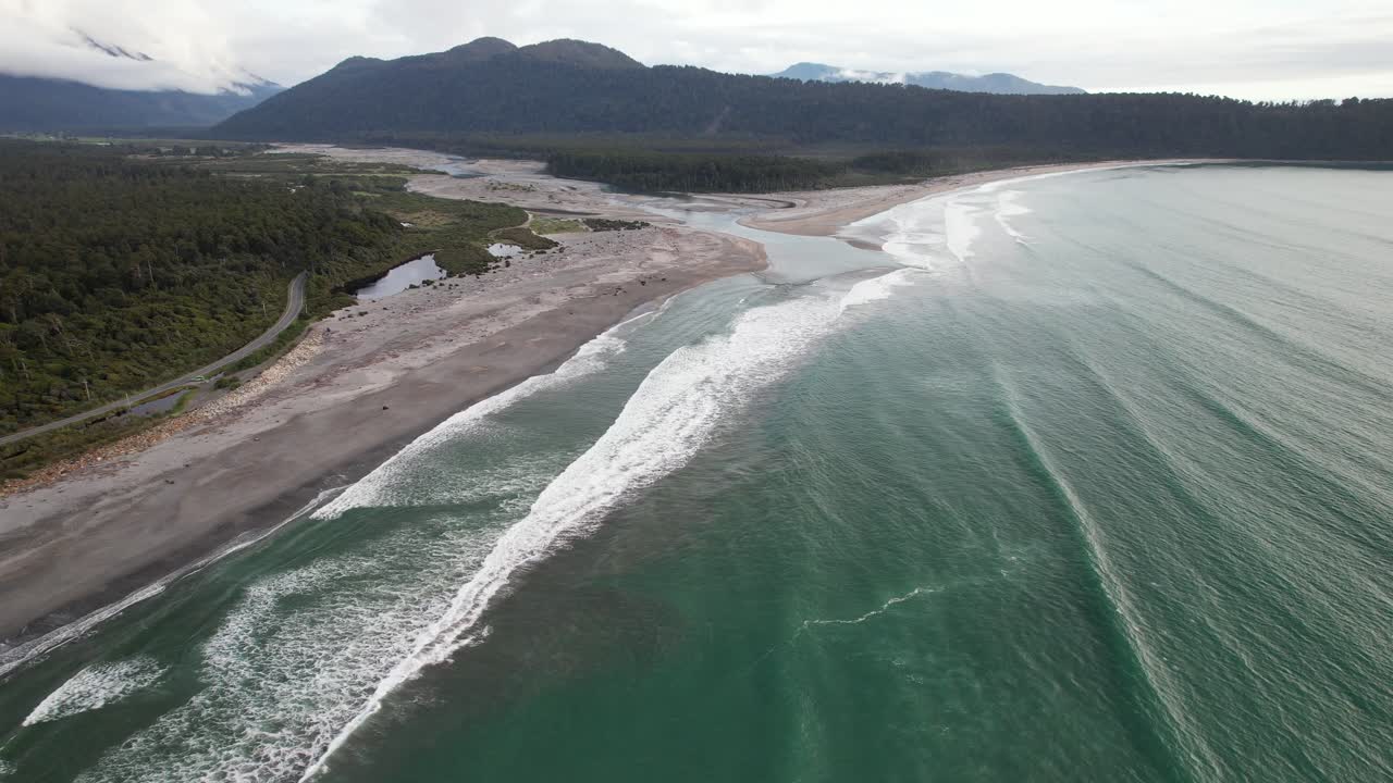 Foamy Waves Splashing On The Shore, Maori Beach In South Island, New Zealand - Aerial Shot