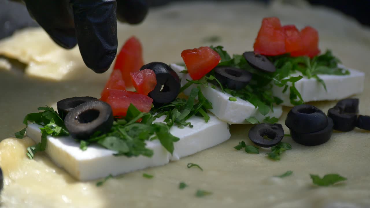Preparing Crepes with Feta, Olives, and Herbs