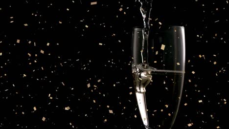 Animation-of-confetti-falling-over-champagne-pouring-into-glass-on-black-background