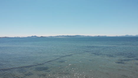 aerial flying over beautiful calm sea in a sunny day