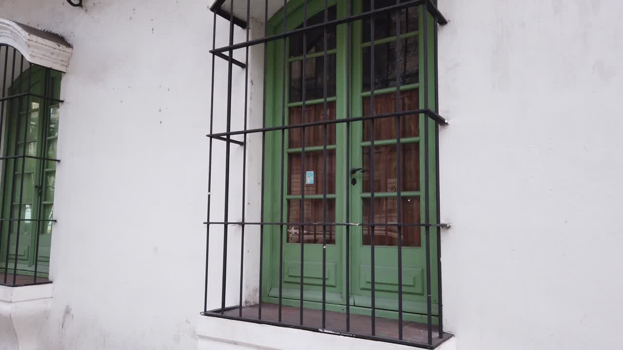 Close up view of Green colonial windows in old historic building white house presidential area of Buenos Aires Argentina