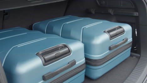 travel and camping luggage packed in the car trunk