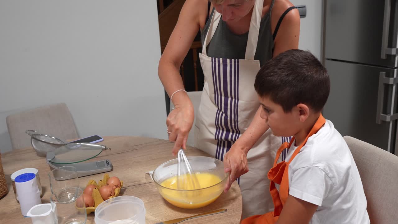 Mother and Child Cooking Together in the Kitchen