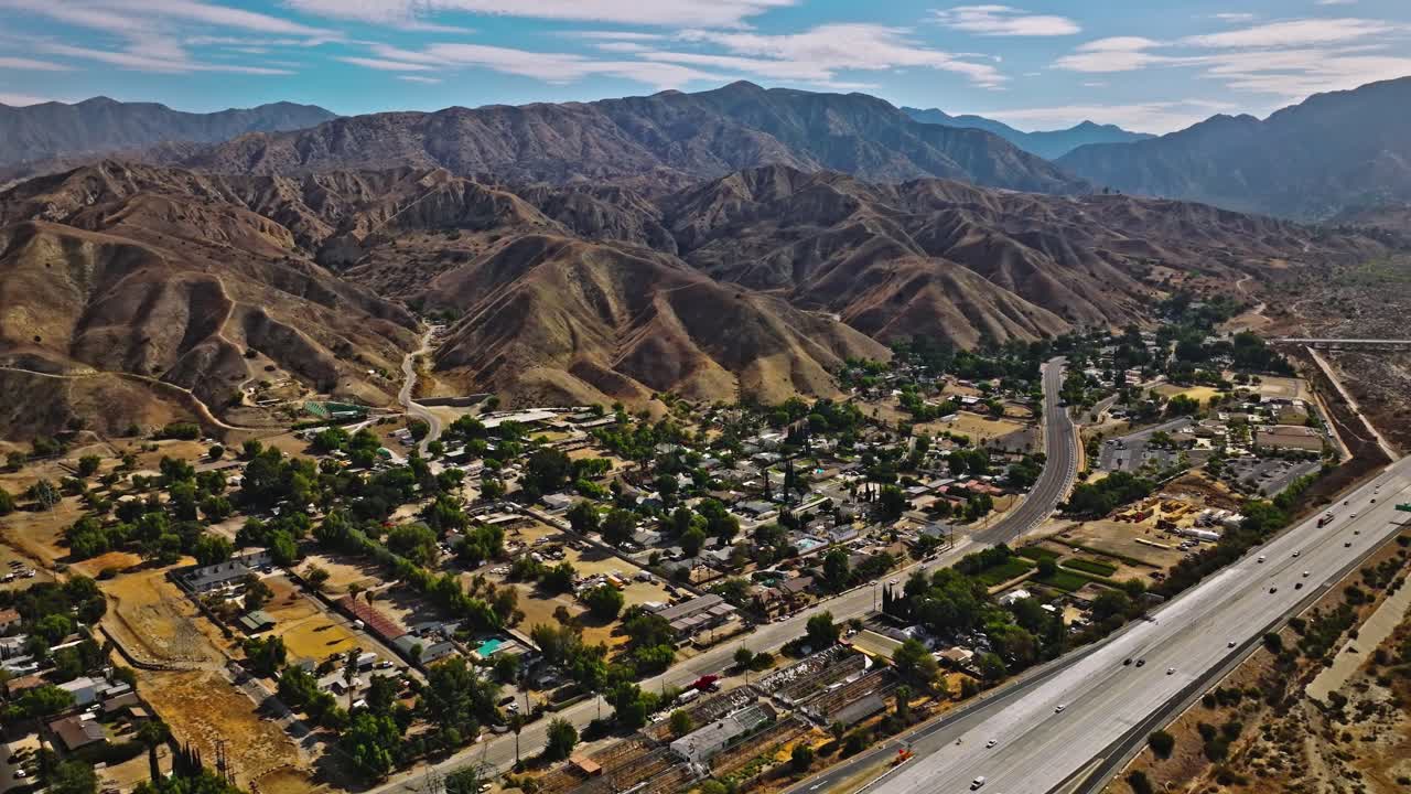 Streets with traffic, houses and trees, Los Angeles suburbs, in California, USA