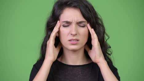 young beautiful woman having headache