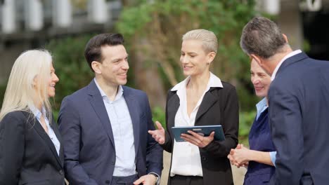 business professionals discussing outdoors