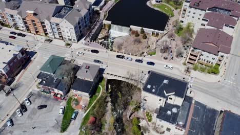 panning-shot-of-a-small-downtown-tourist-town-with-waterfall