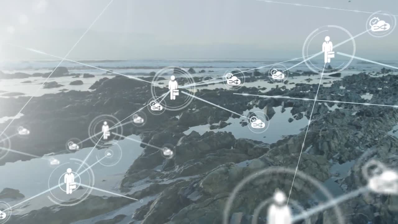 animación de iconos conectados sobre rocas en la orilla del mar contra un cielo nublado