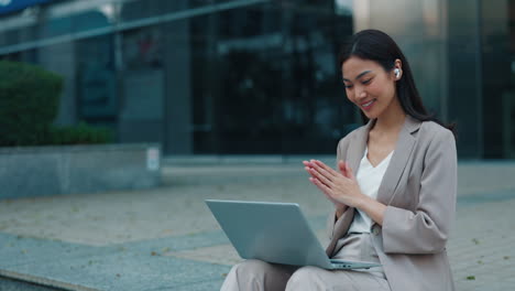 businesswoman on video call outdoors
