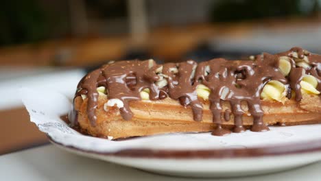 chocolate-covered cream puff