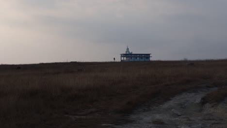 isolate church at yellow grass mountain with misty flat sky at morning from different angle video taken at cherrapunji meghalaya india.