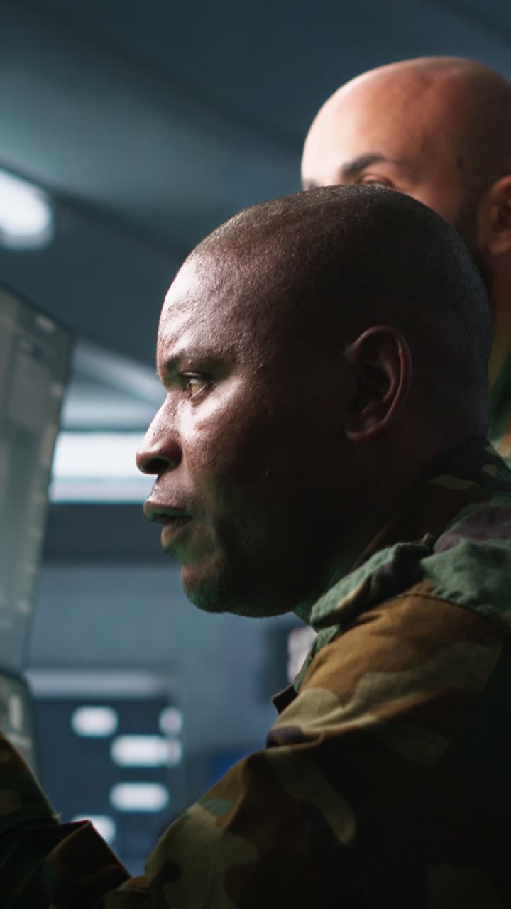 Vertical video Team of army telecommunications operators using radio and satellite gear