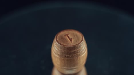 macro video of wooden bingo barrel, casino gambling game, digits on top, number 1, 120 fps, slow motion