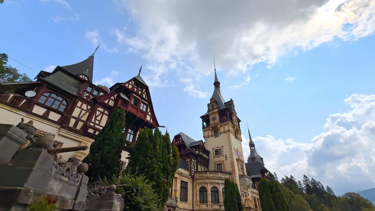Sinaia, Romania, 17 July 2025: Peles Castle in Romania with towers and gothic details. View of the famous Peles Castle in Sinaia, Romania, showing its towers and Neo-Renaissance gothic details against the blue sky