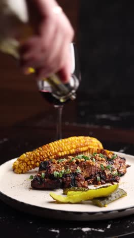 grilled pork ribs with corn and pickled cucumbers