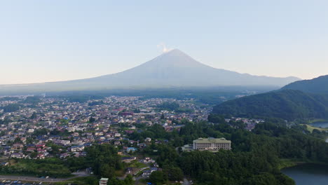 establishing drone shot of mt fuji and the fujikawaguchiko town, sunset in japan