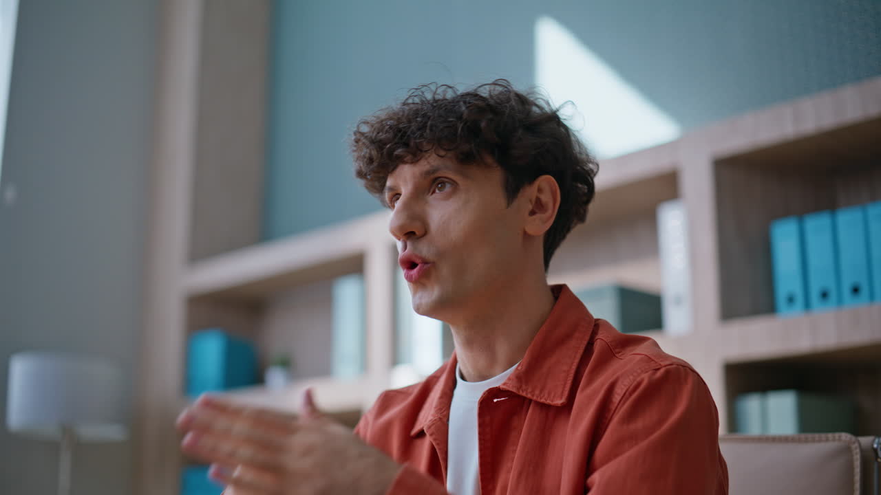 Entrepreneur sharing ideas video conference at work space closeup. Smiling man