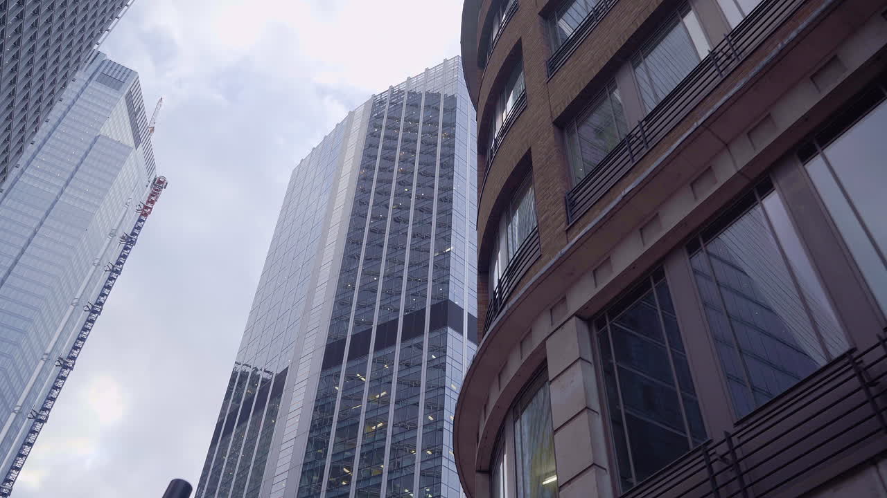 POV shot walking under the buildings of the City of London.