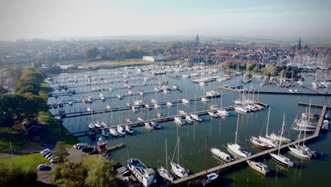 drone view over docked boats and ships in a harbor