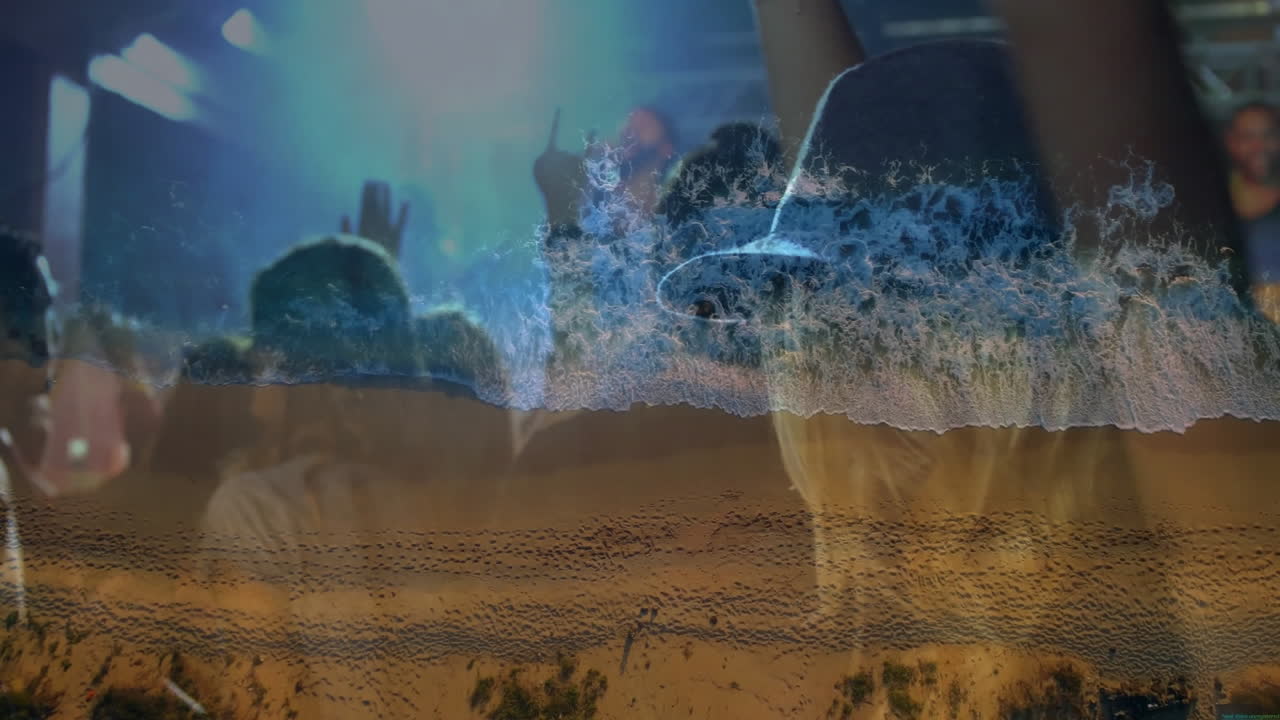 concert crowd raising hands in music marketing visual, blending ocean waves and sandy footprints