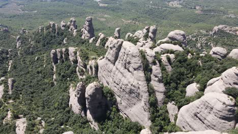 Aerial-views-of-Montserrat-peaks,-a-mountain-range-in-Catalonia