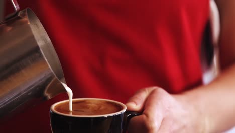 Close-up-of-waitress-pouring-coffee