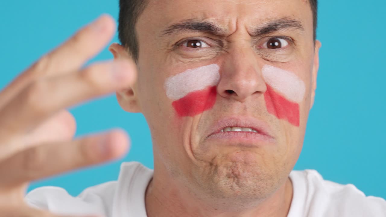 Man with polish national flag upset with a referee