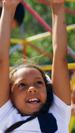 trainer assisting schoolkids while playing in playground