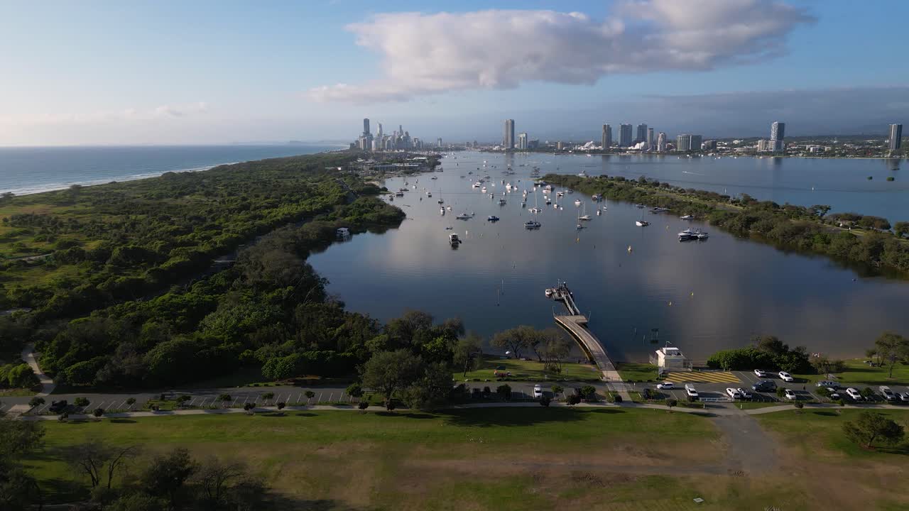 Forward moving aerial view over Doug Jennings Park looking South towards Surfers Paradise, Gold Coast, Australia.