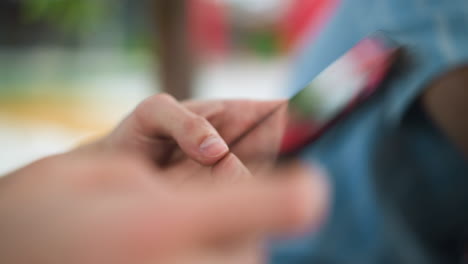 nearer glimpse of thumb finger dabbing on mobile screen with subtle touch gestures over sleek display interface in resolution close up shot tactile smartphone interaction navigation movements