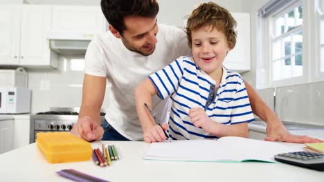 Father-helping-son-with-homework