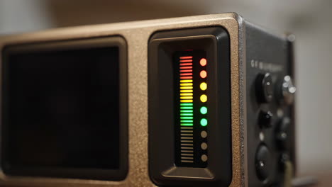 close-up of an audio level meter on professional recording equipment