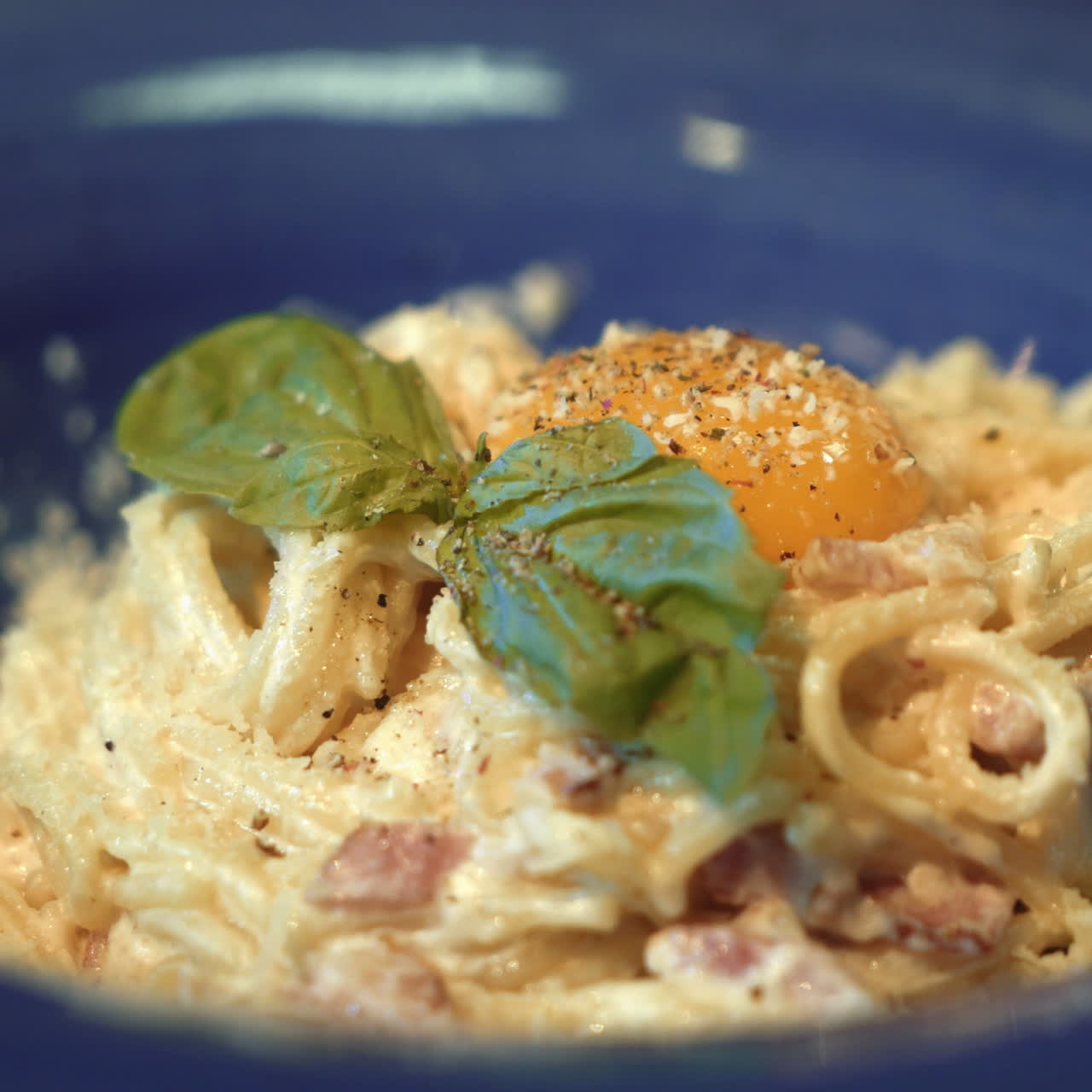 Pasta Carbonara. Spaghetti with bacon, basil, parmesan cheese and yolk. Italian Cuisine. Sqare video