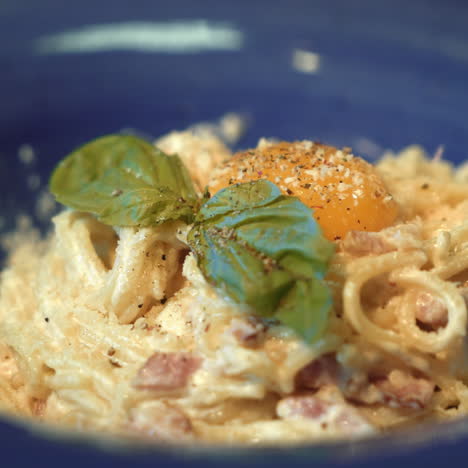 pasta carbonara. spaghetti with bacon, basil, parmesan cheese and yolk. italian cuisine. sqare video