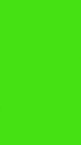 Vertical-Video-Silhouette-Of-Businessman-Wearing-Suit-Walking-Across-Frame-Against-Green-Screen-Background-1