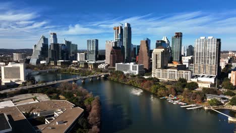 riverside skyline of the austin city, sunny autumn day in texas, usa - circling, drone shot