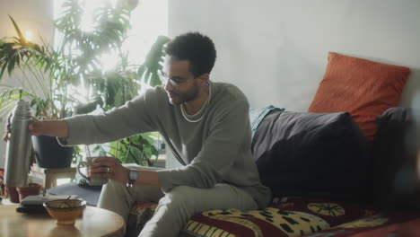 man drinking tea at home