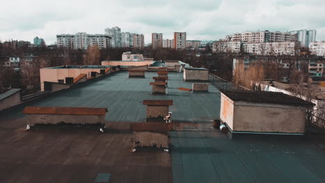 drone flying over the roof of two buildings in chisináu, moldova