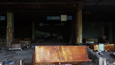 Abandoned-and-destroyed-building-interior-of-Pripyat,-pan-left-view