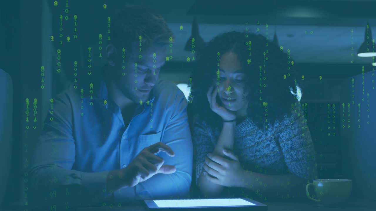 Animation of data processing over diverse male and female colleagues using digital tablet at office