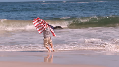 mature man shaking an american flag