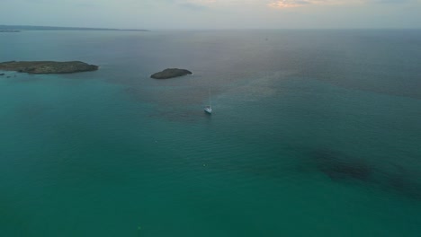 Lonely-alone-sailboat-in-front-of-island