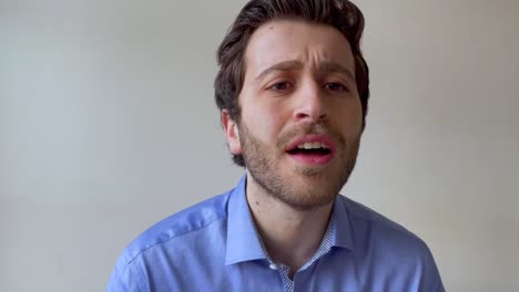 young male university lecturer looking visibly touched after students thank him