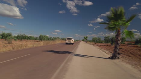 Slow-trucking-left-movement-of-road-with-jeep-passing-by