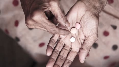 elderly person taking medication