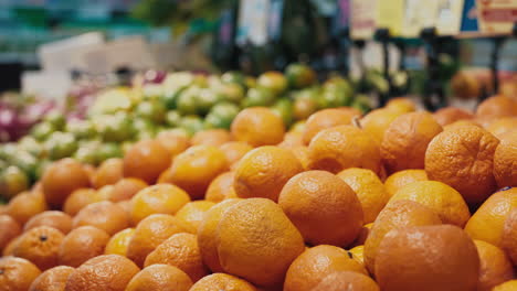 picking oranges at a grocery store