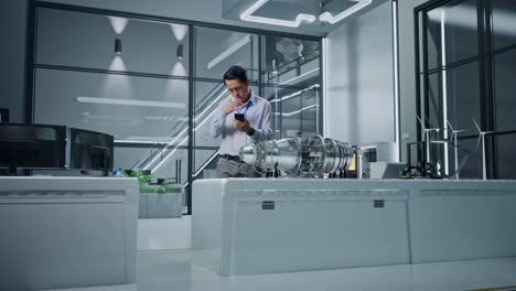 engineer consulting jet engine design in modern lab